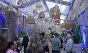Group of people listening to a speaker talk