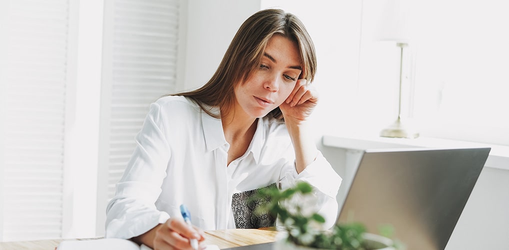Female student working from home on laptop
