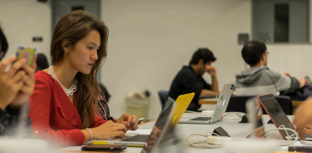 Higher Ed student reviewing feedback forms